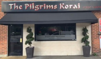 The Pilgrims Korai outside